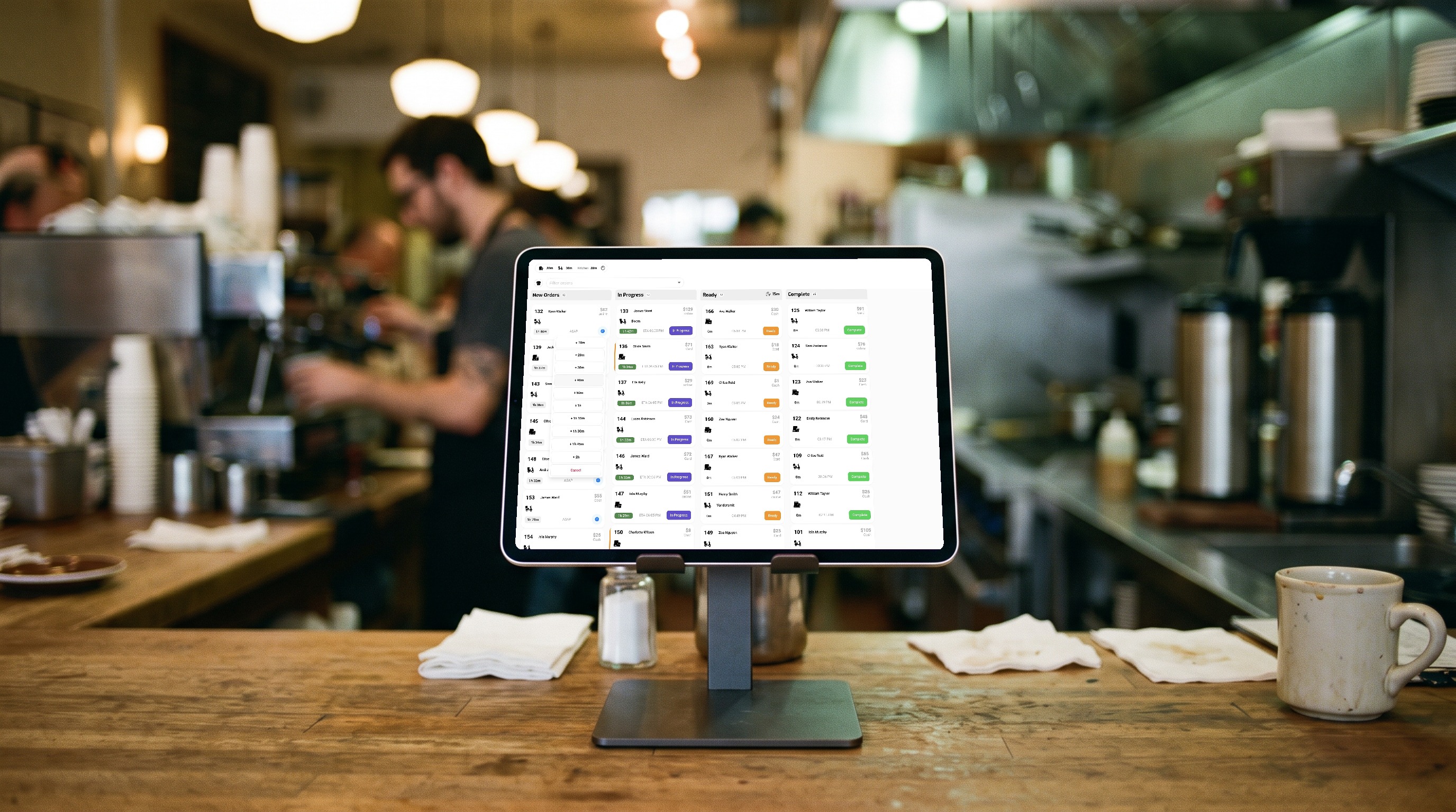 The Asky Orders dashboard on a tablet, showing New Orders, In Progress, Ready and Complete columns